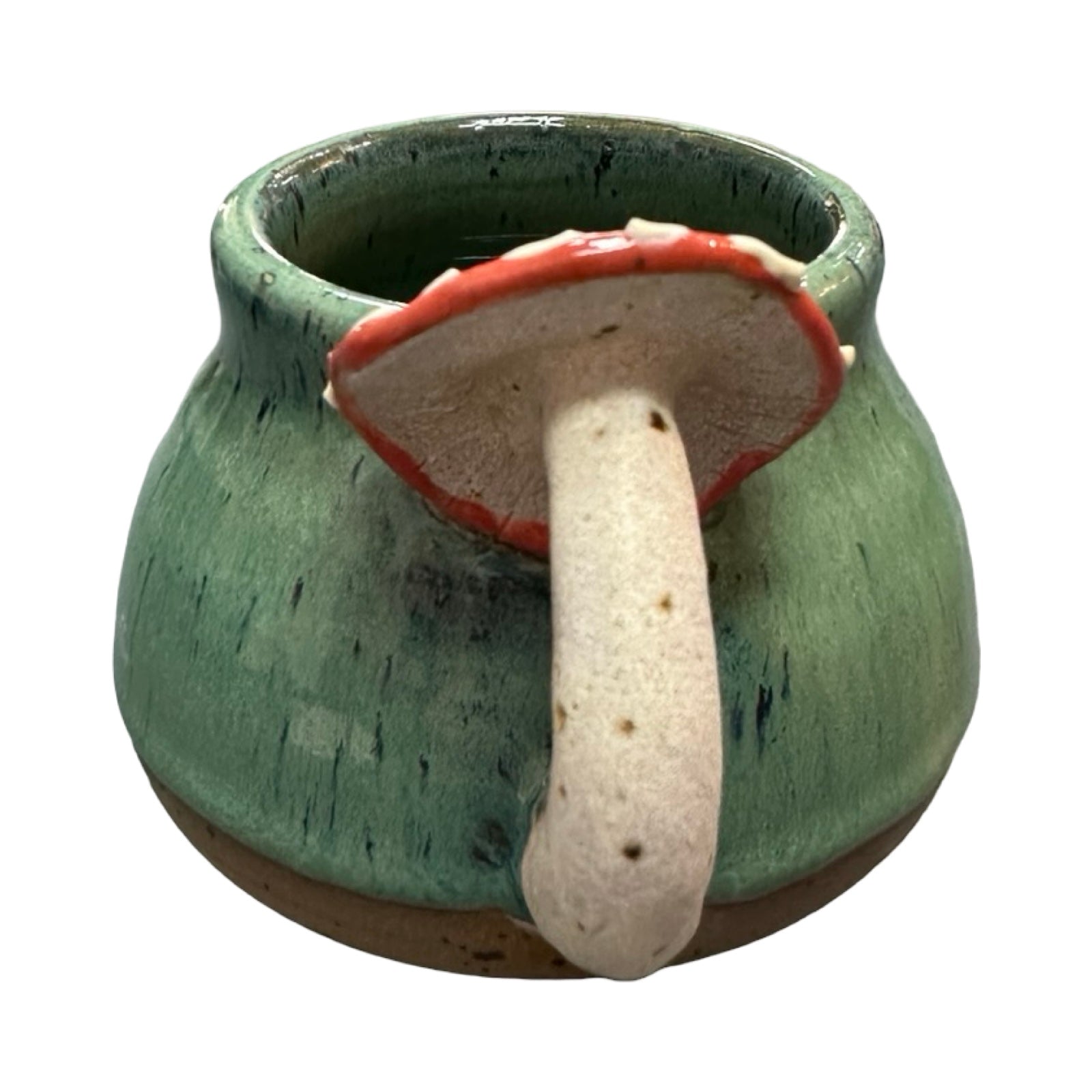 Ceramic mug with a mushroom handle and a green body on a white background.