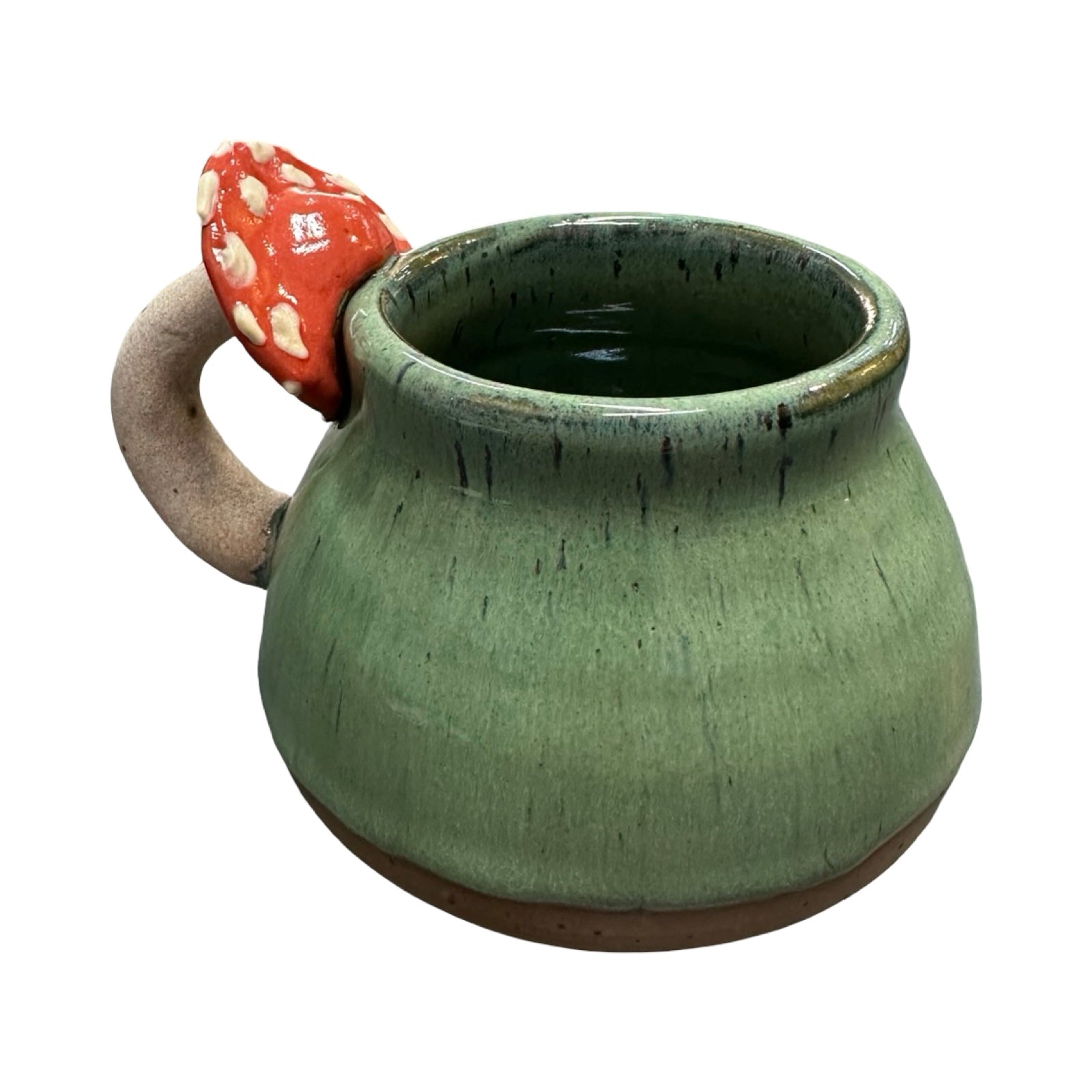 Green ceramic mug with a mushroom handle on a white background.