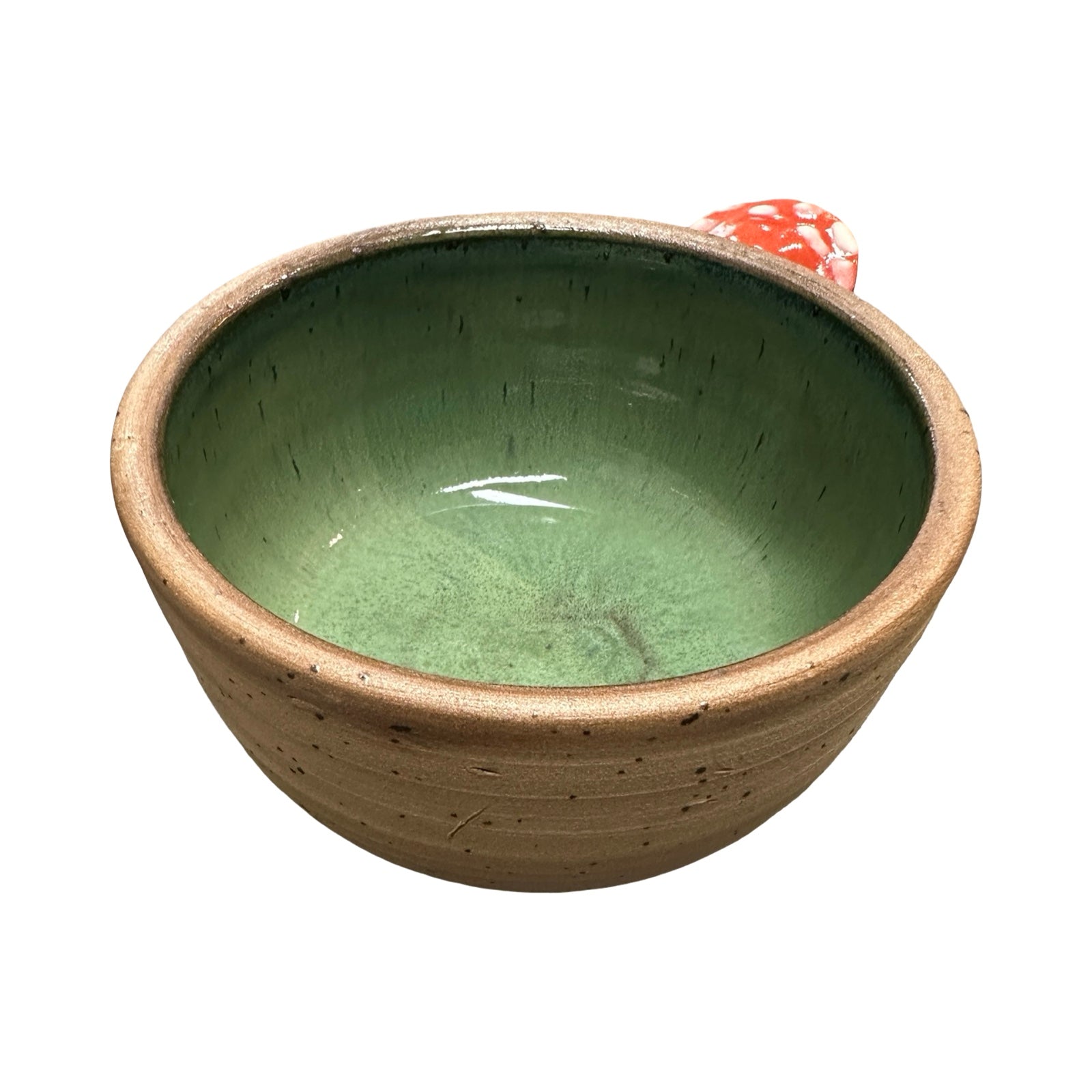 Ceramic trinket dish with green interior and beige exterior on a white background.