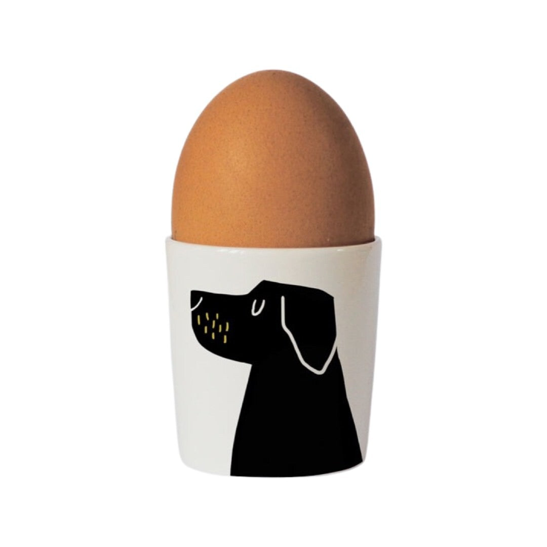 Bone china egg cup with an illustration of a black Labrador on the front.