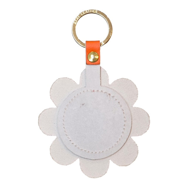 The back of a flower shaped leather keyring