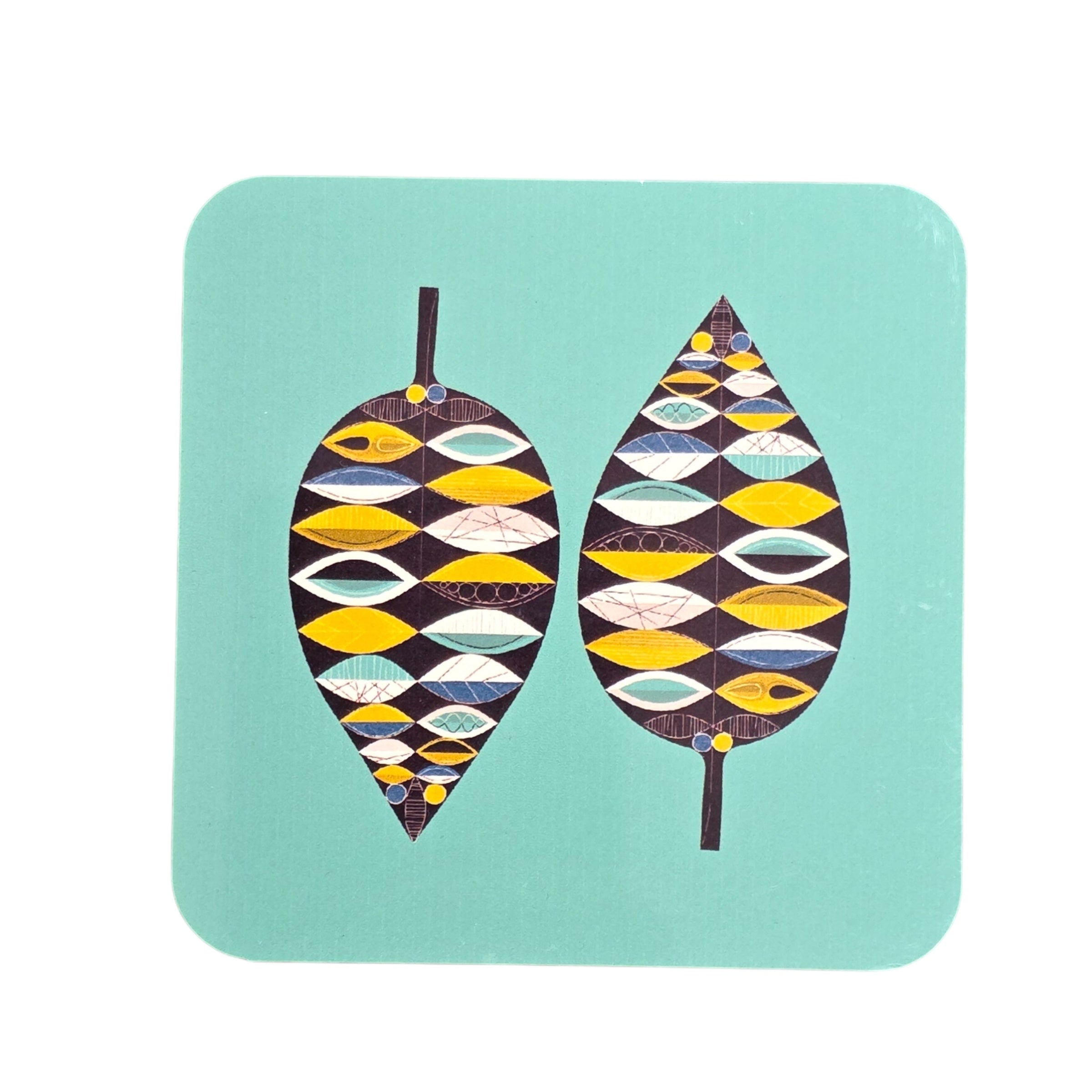 An image of a coaster with a green background and two leaves in an abstract design. 