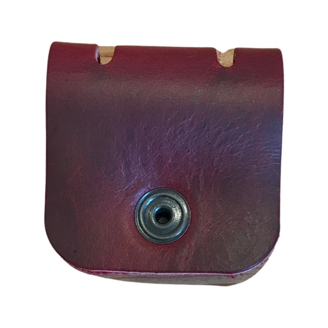 Leather cable organiser in burgundy.