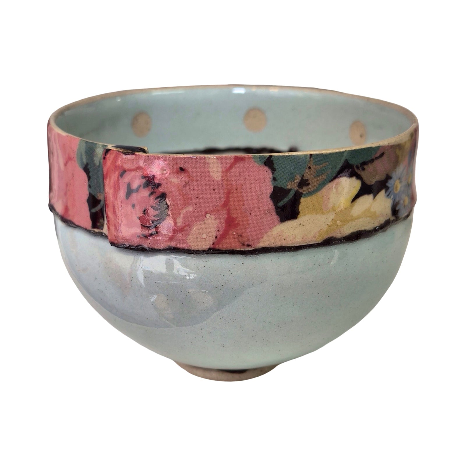 Ceramic bowl with a multicoloured rim on a white background.