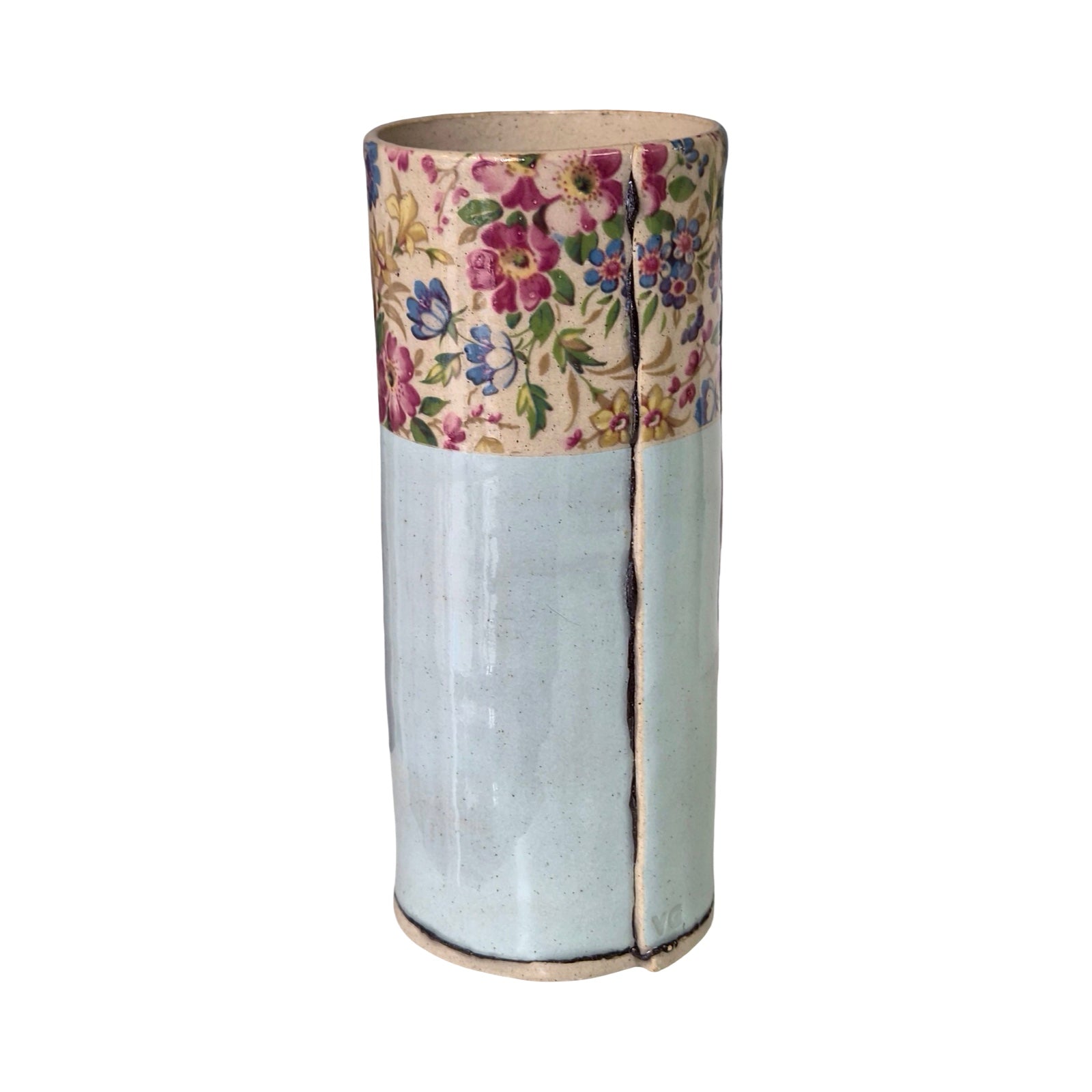 Cylindrical vase with floral top section and plain bottom on a white background.