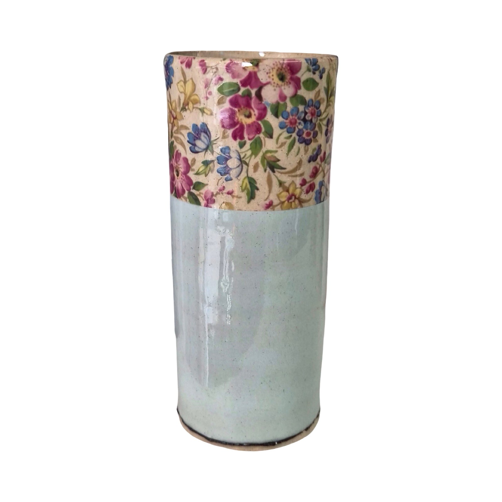 Cylindrical vase with floral-patterned top section on a white background.