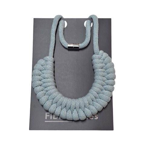 A hand-knotted style necklace made by hand from 100% recycled light blue cotton cord with a magnetic metal fastening. 
