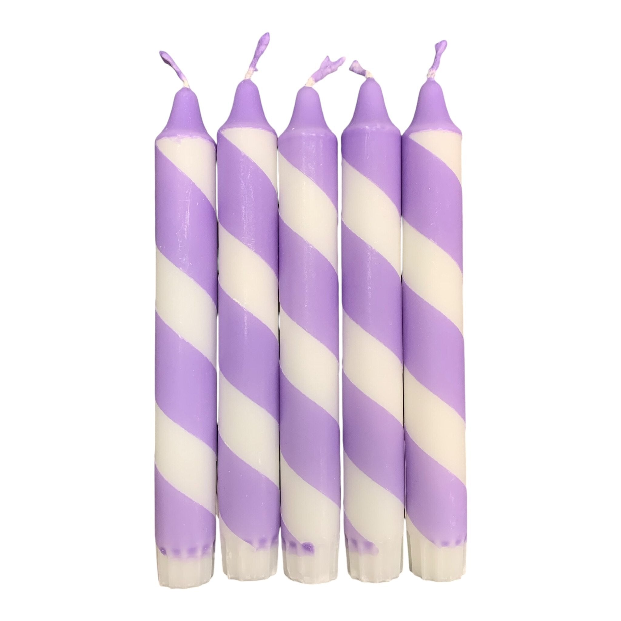 A row of 5 handmade dinner candle with lilac and white diagonal stripes.