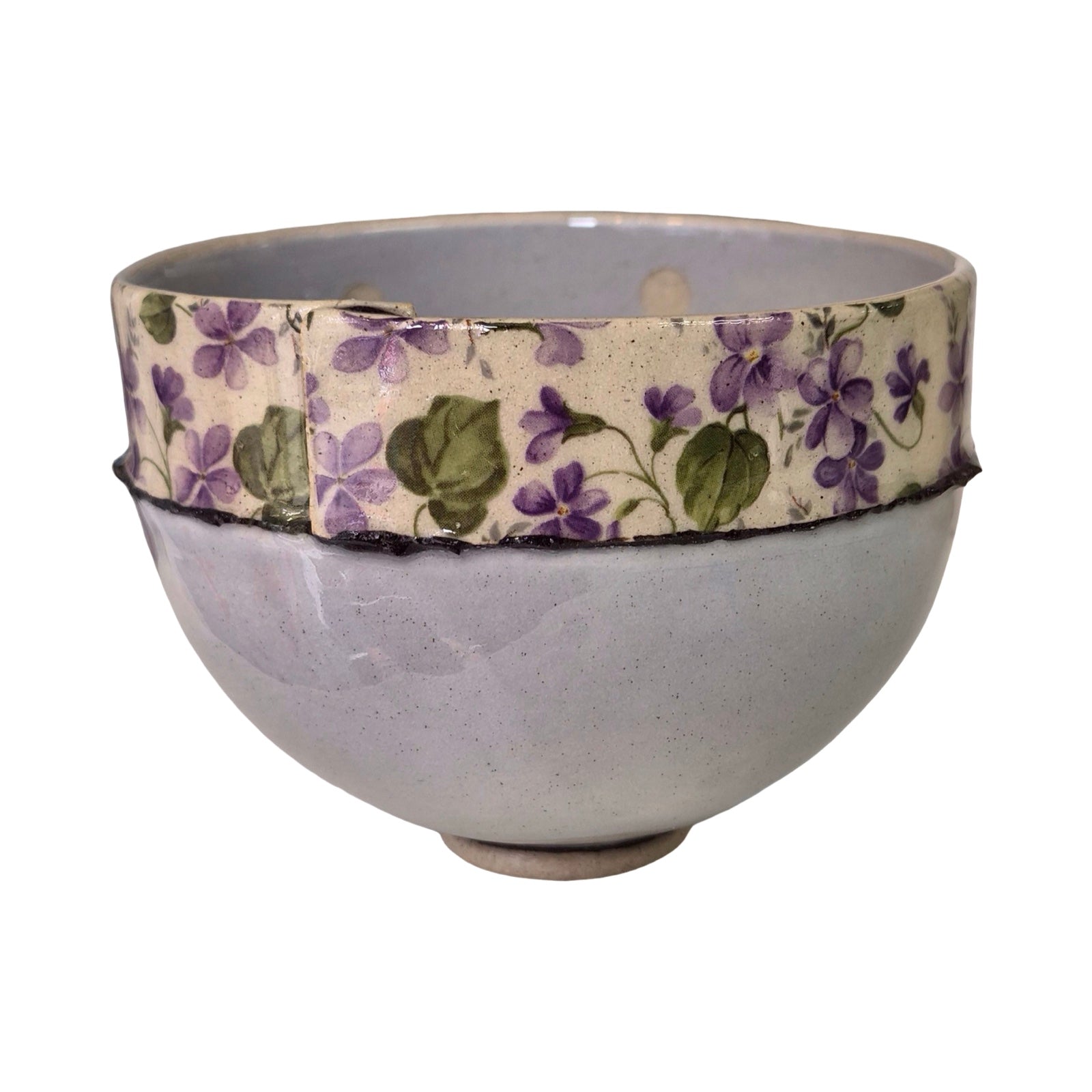 Ceramic bowl with floral band on a white background.