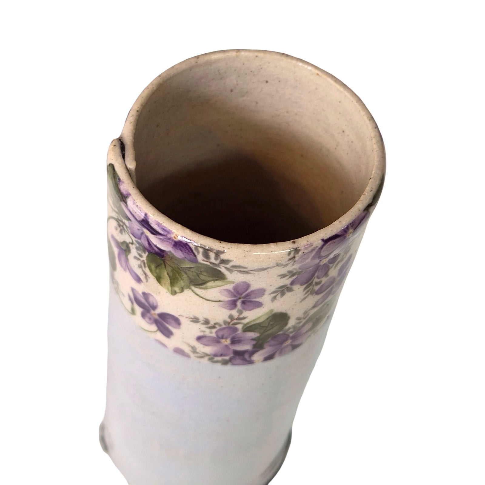 Ceramic vase with floral pattern on a white background.