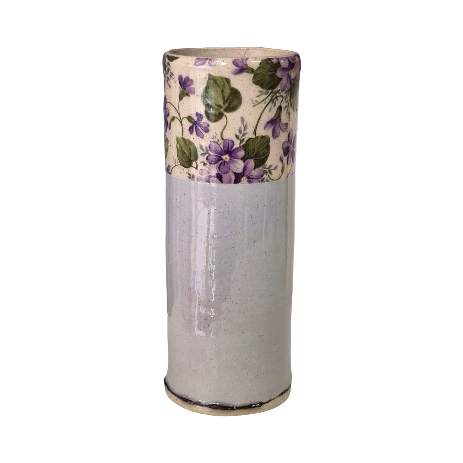 Cylindrical ceramic vase with floral pattern on a white background.
