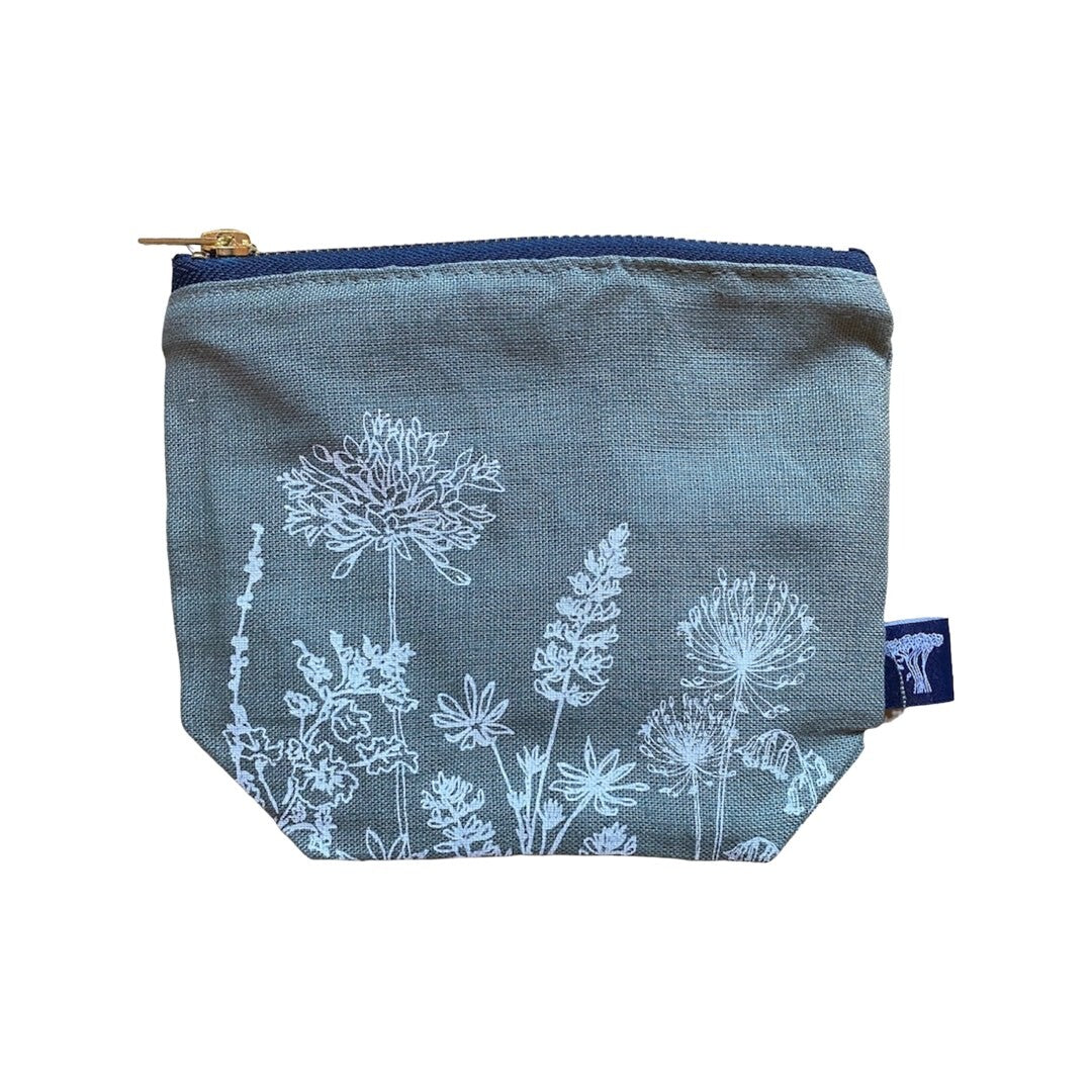 Screen-printed linen make-up bags with a soft waterproof lining and a brass zip.