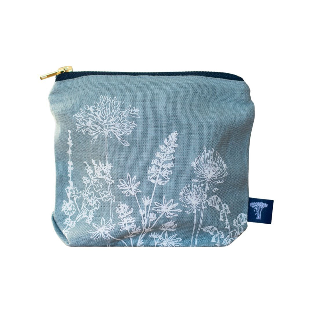 Screen-printed linen make-up bags with a soft waterproof lining and a brass zip.
