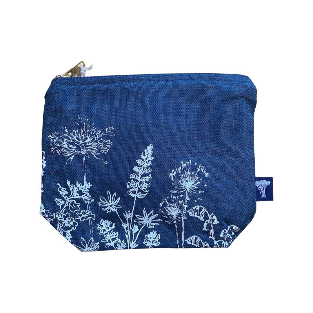 Screen-printed linen make-up bags with a soft waterproof lining and a brass zip.