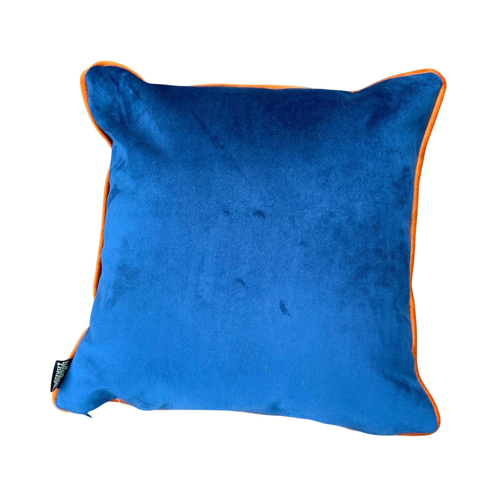 A blue velvet cushion back with orange velvet piping.