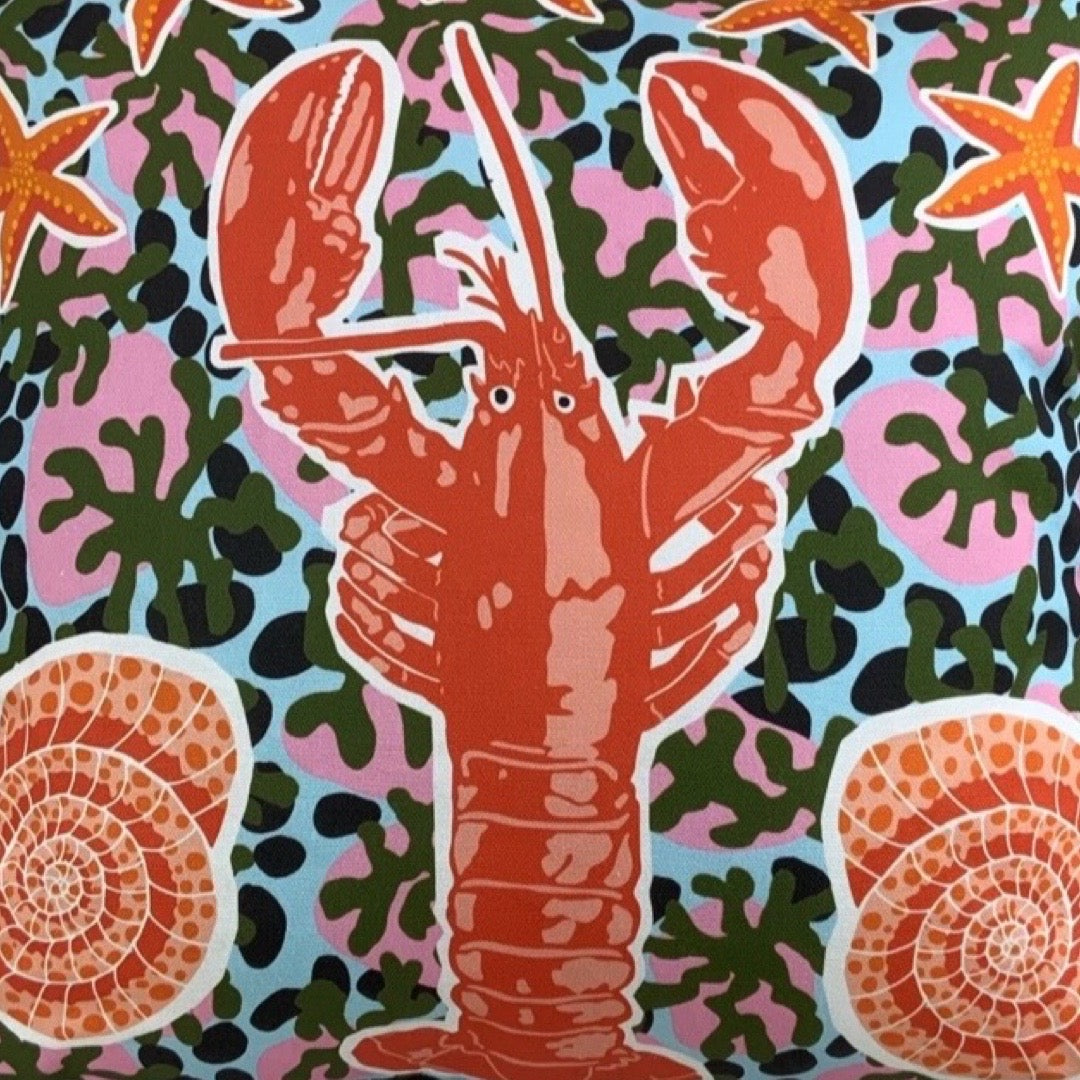 Colorful pattern with a lobster, starfish, and shells on a multicoloured background.