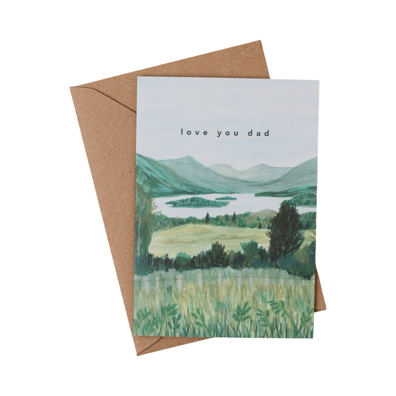 Greeting card with nature scene and 'love you dad' text, with a brown envelope.