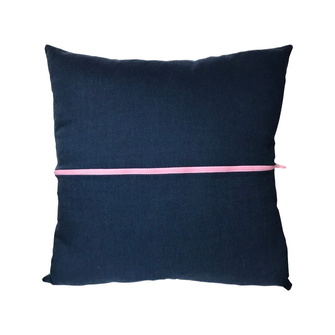 Plum back of cushion with a violet zip.