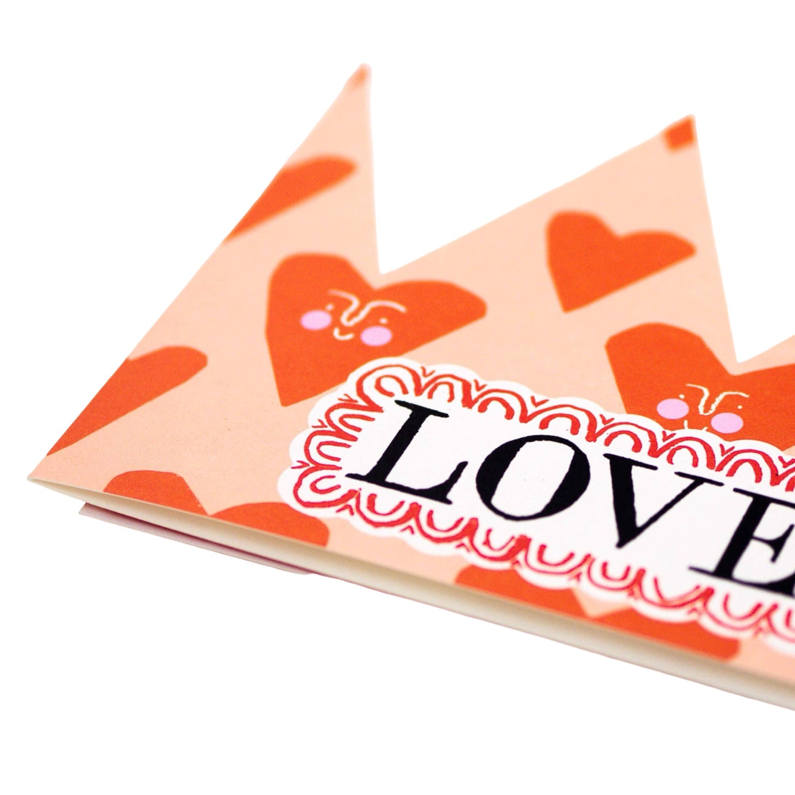 A gorgeous pink crown-shaped card with red love hearts and the text 'Loved'. 