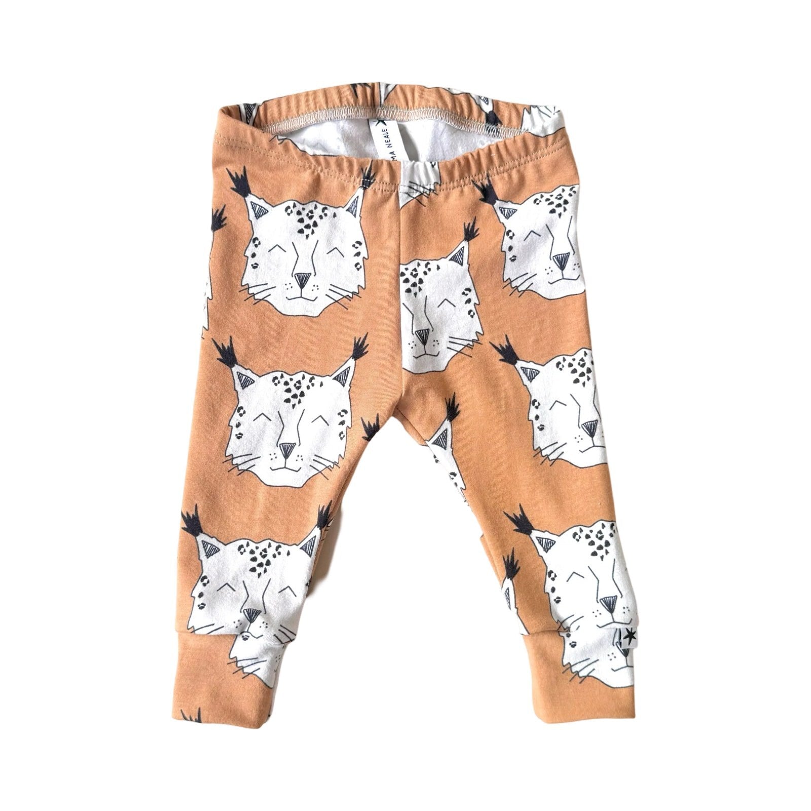 Brown harem leggings with a lynx pattern, featuring a stiff waist elastic and finished with cuffs.