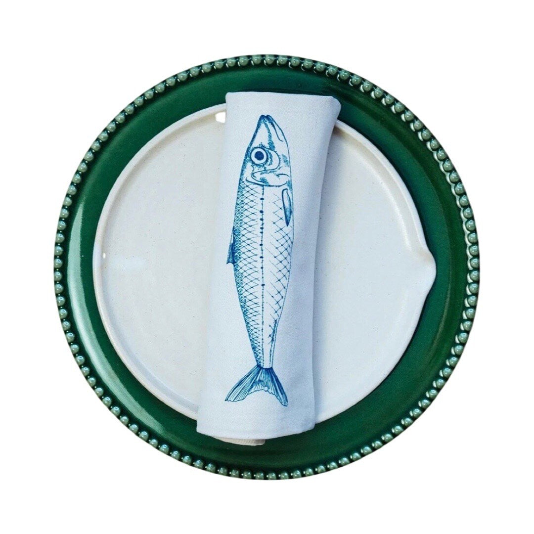 Screen-printed cream serviette featuring an original illustration of a mackerel in blue.