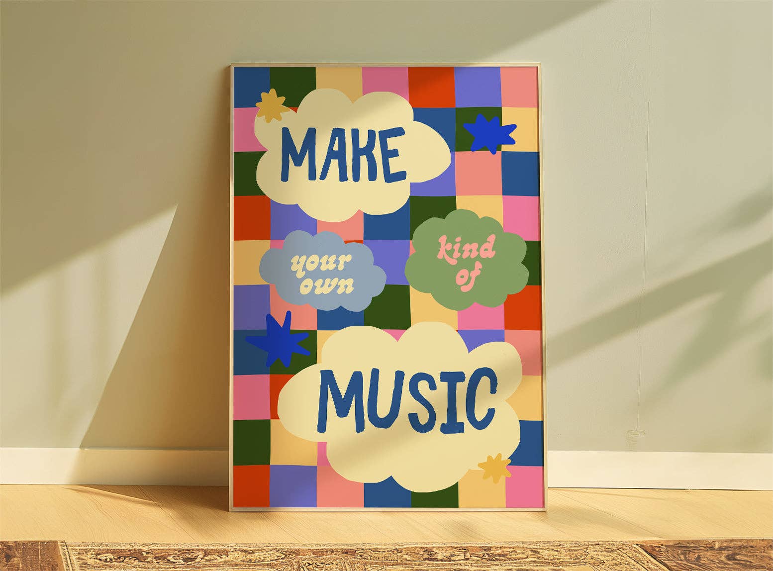 Colourful wall art with text 'MAKE your own kind of MUSIC' on a geometric patterned background.