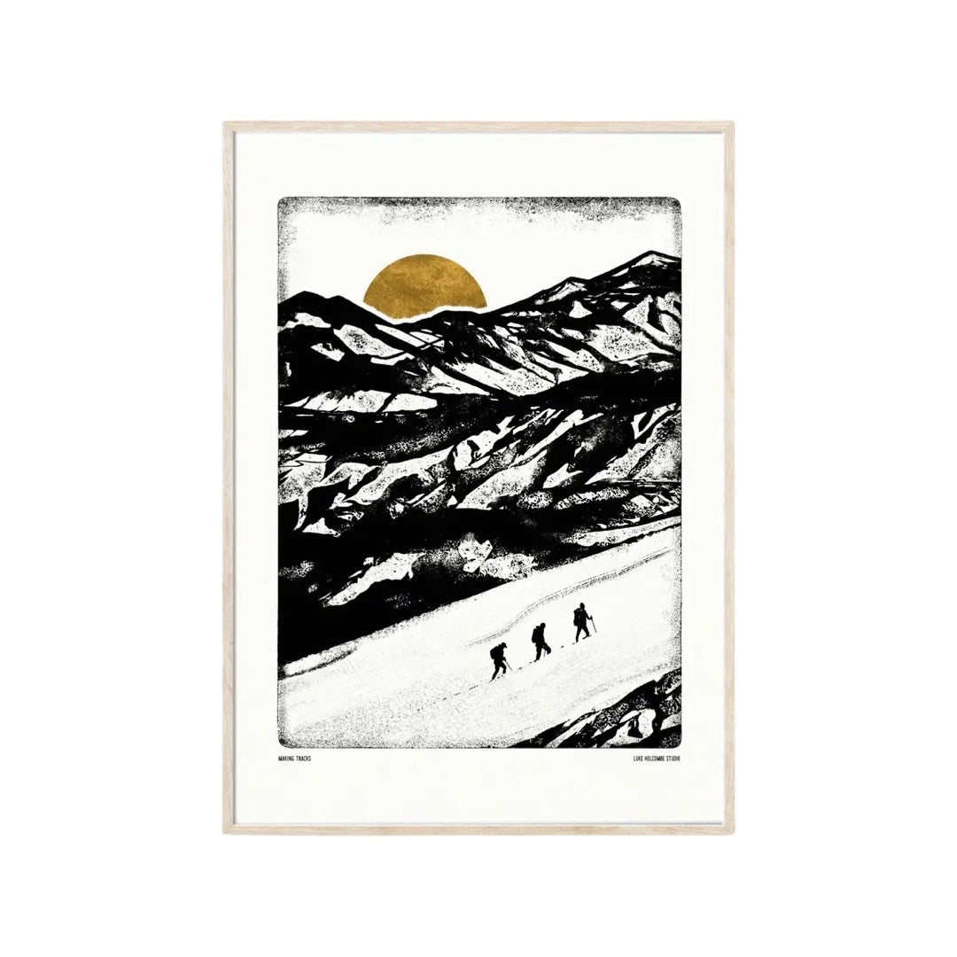 Monochrome print featuring a group of hikers climbing up a mountain in the snow and a mustard-coloured sun setting behind the mountains