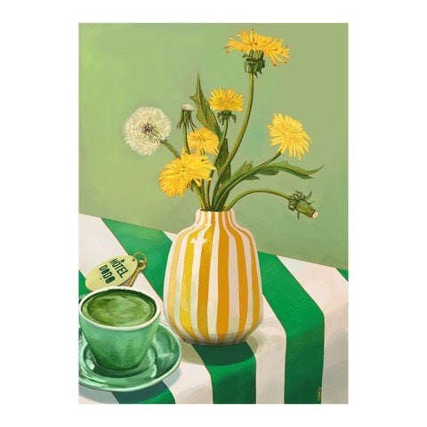 Green and yellow print featuring a gold and white striped vase with a bunch of yellow and white flowers sitting on a table with a green and white strip tablecloth and a cup of tea.