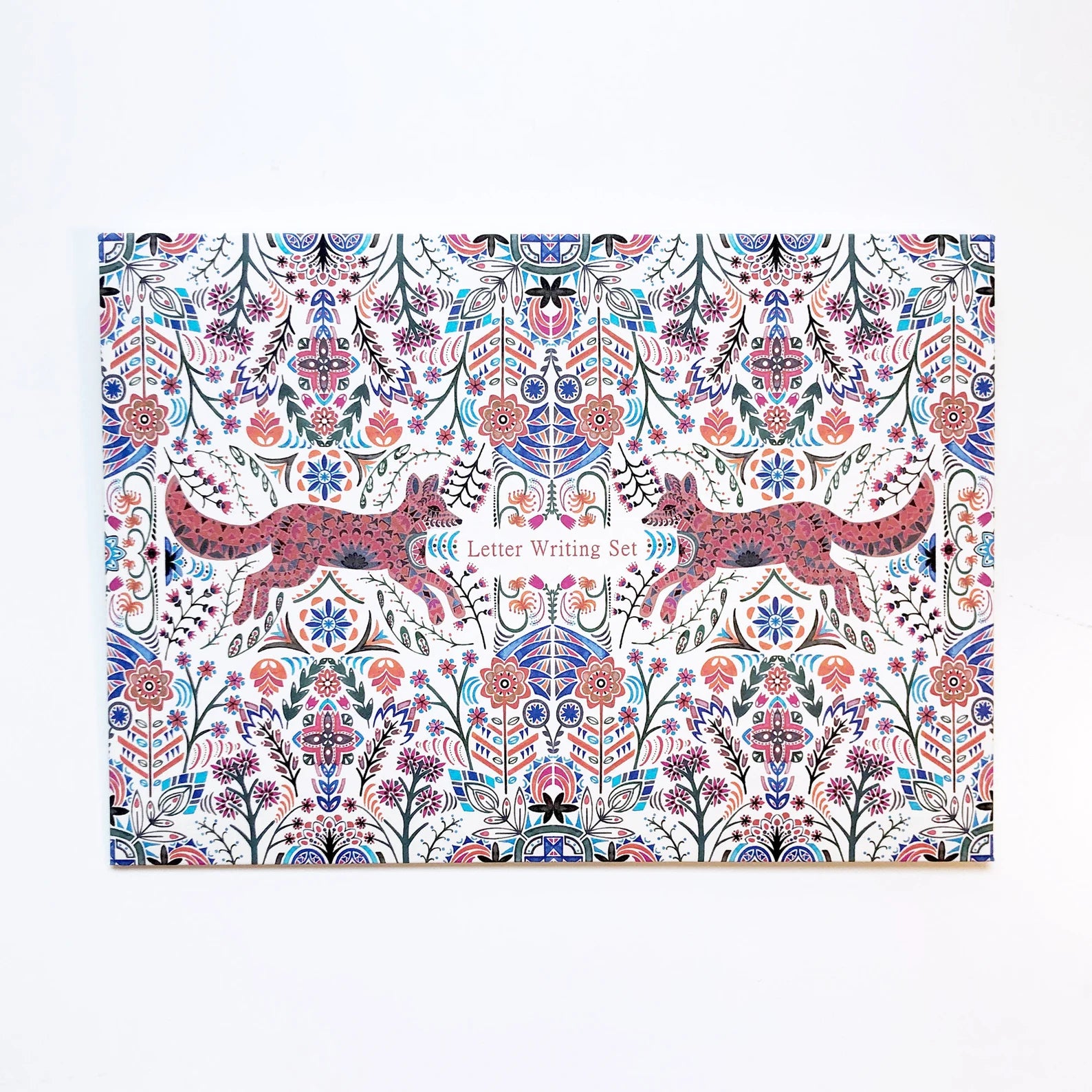 Letter writing set with floral and animal design on a white background.