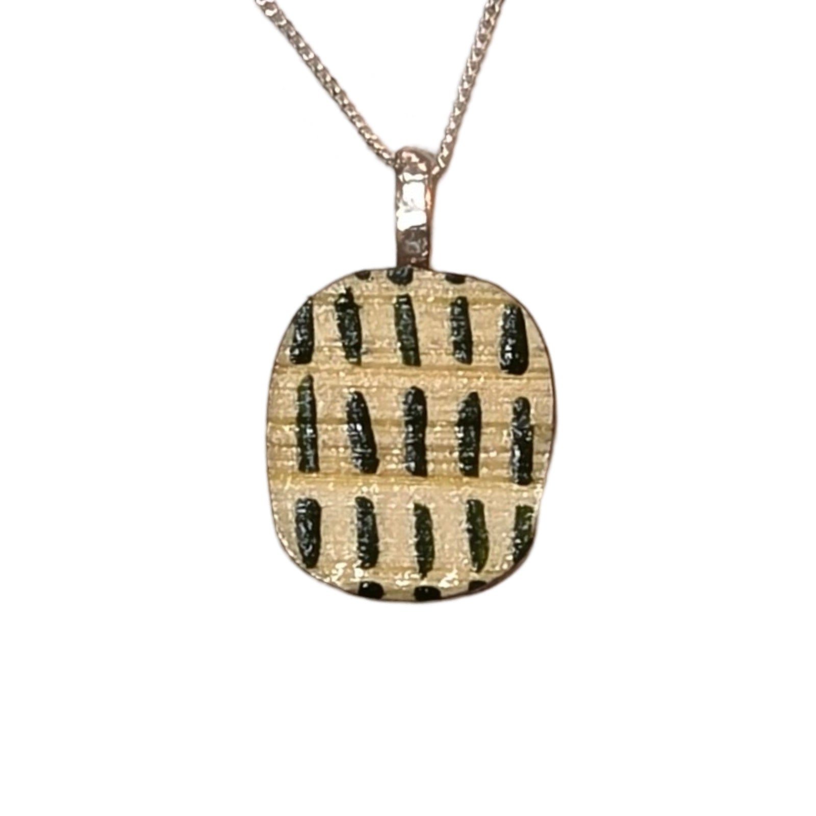 A small bamboo oval-shaped pendant necklace with green dashes on a sterling sliver chain.