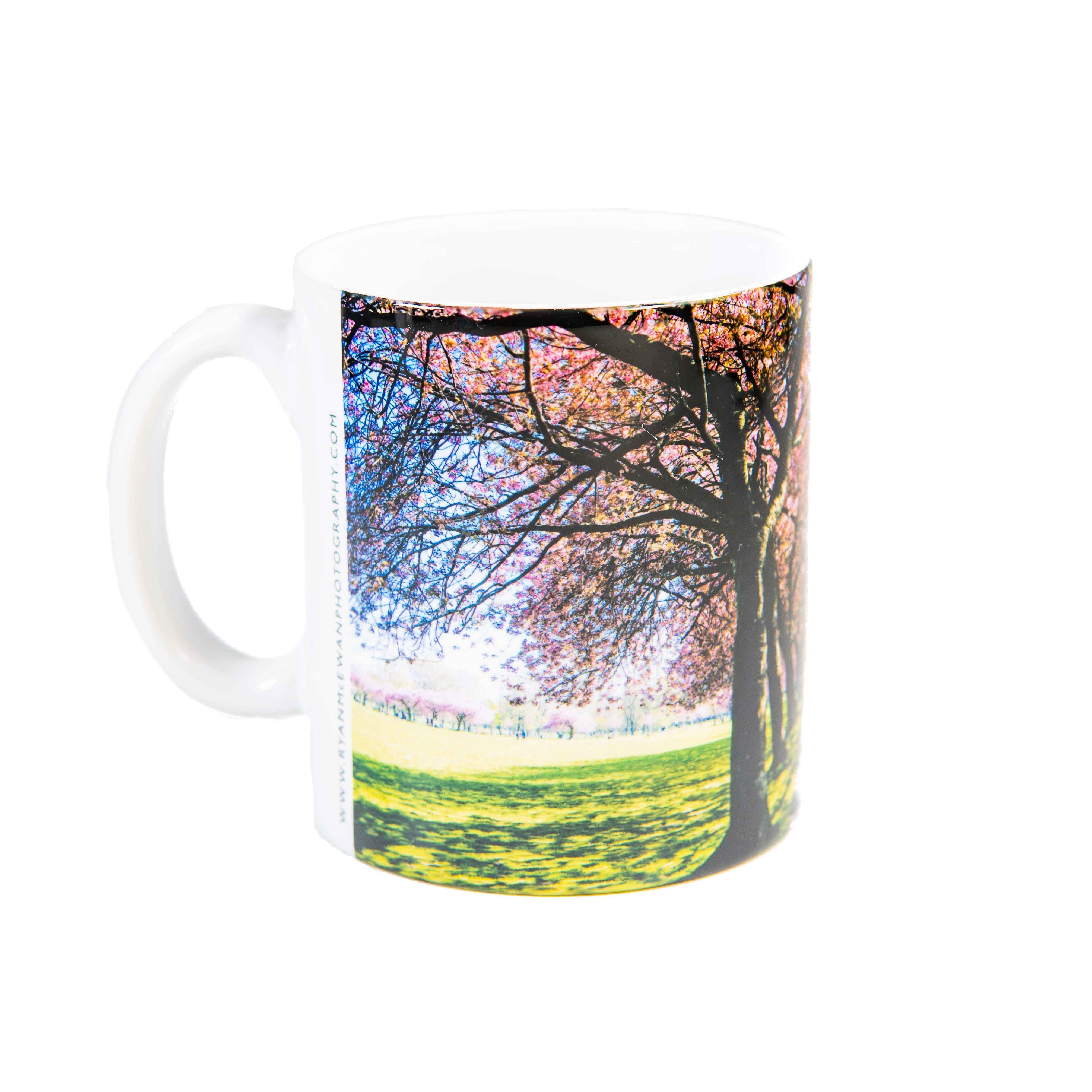 An image of a mug with a picture of the Edinburgh Meadows on it. 