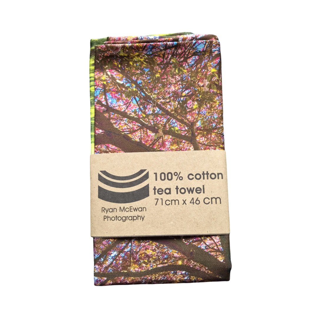 Tea towel with floral design and Ryan McEwan Photography branding on a white background