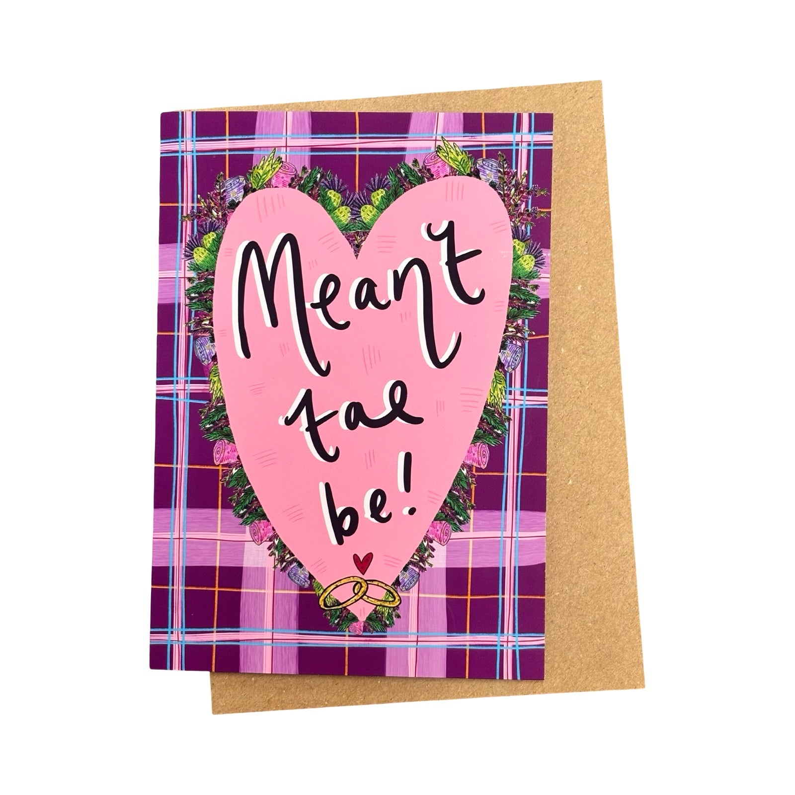 Greeting card with pink heart and 'Meant to be!' text on a tartan background.