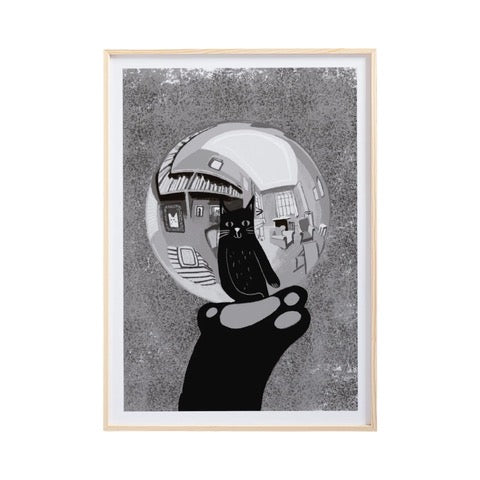 Cat print featuring an illustration of the reflection of a black cat in a glass ball being held by a cat's paw in the style of the artist M C Escher. 