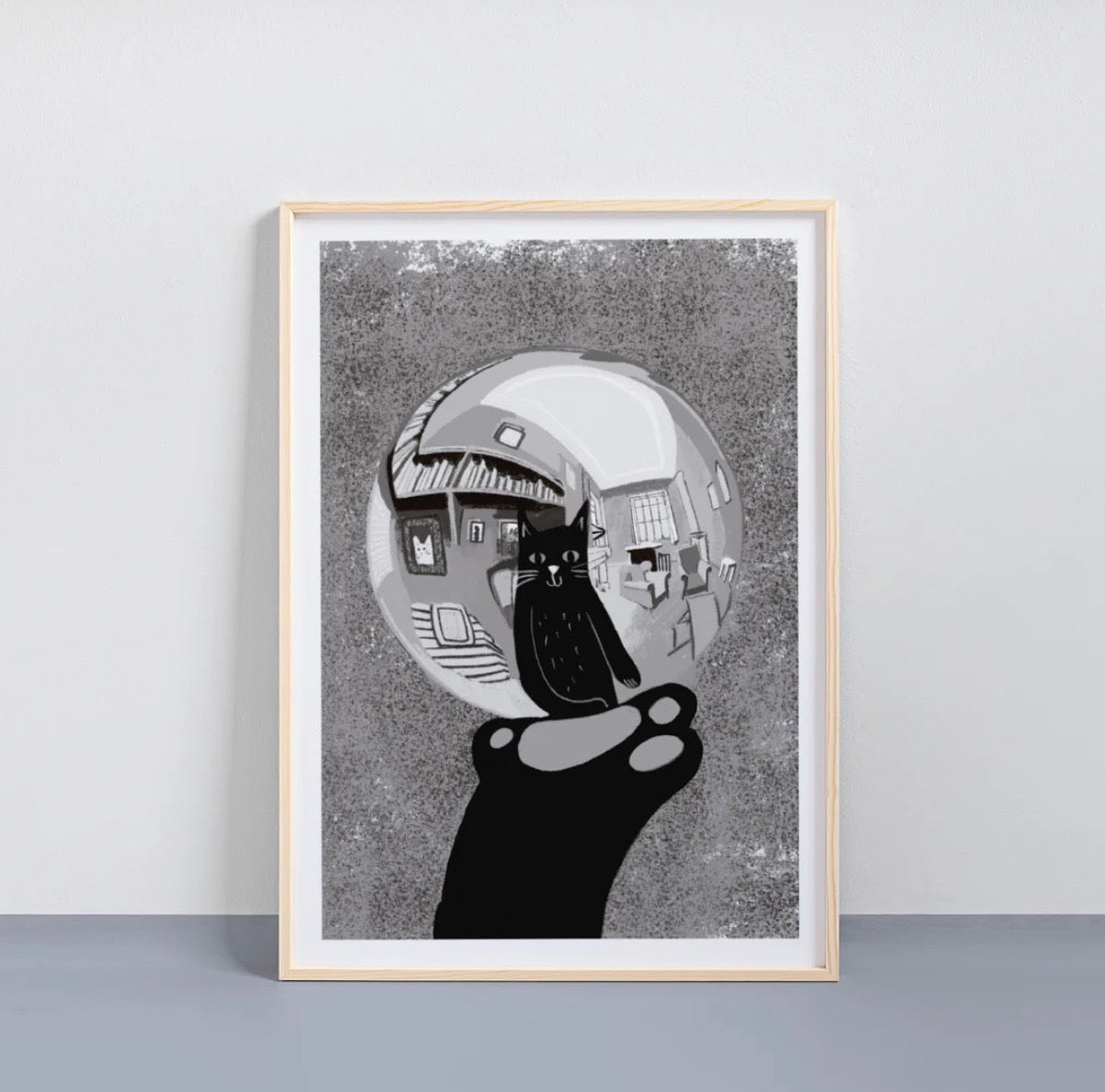 Framed artwork of a black and white abstract design with a textured background.