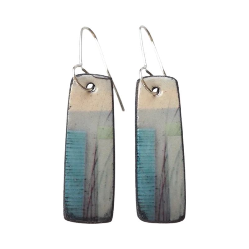 These porcelain drop earrings are made from black porcelain casting slip layered with a white decorating slip and a ceramic decal.