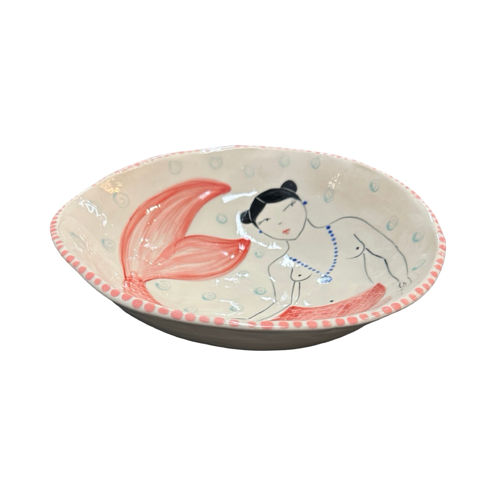 Ceramic bowl with mermaid design on a white background.