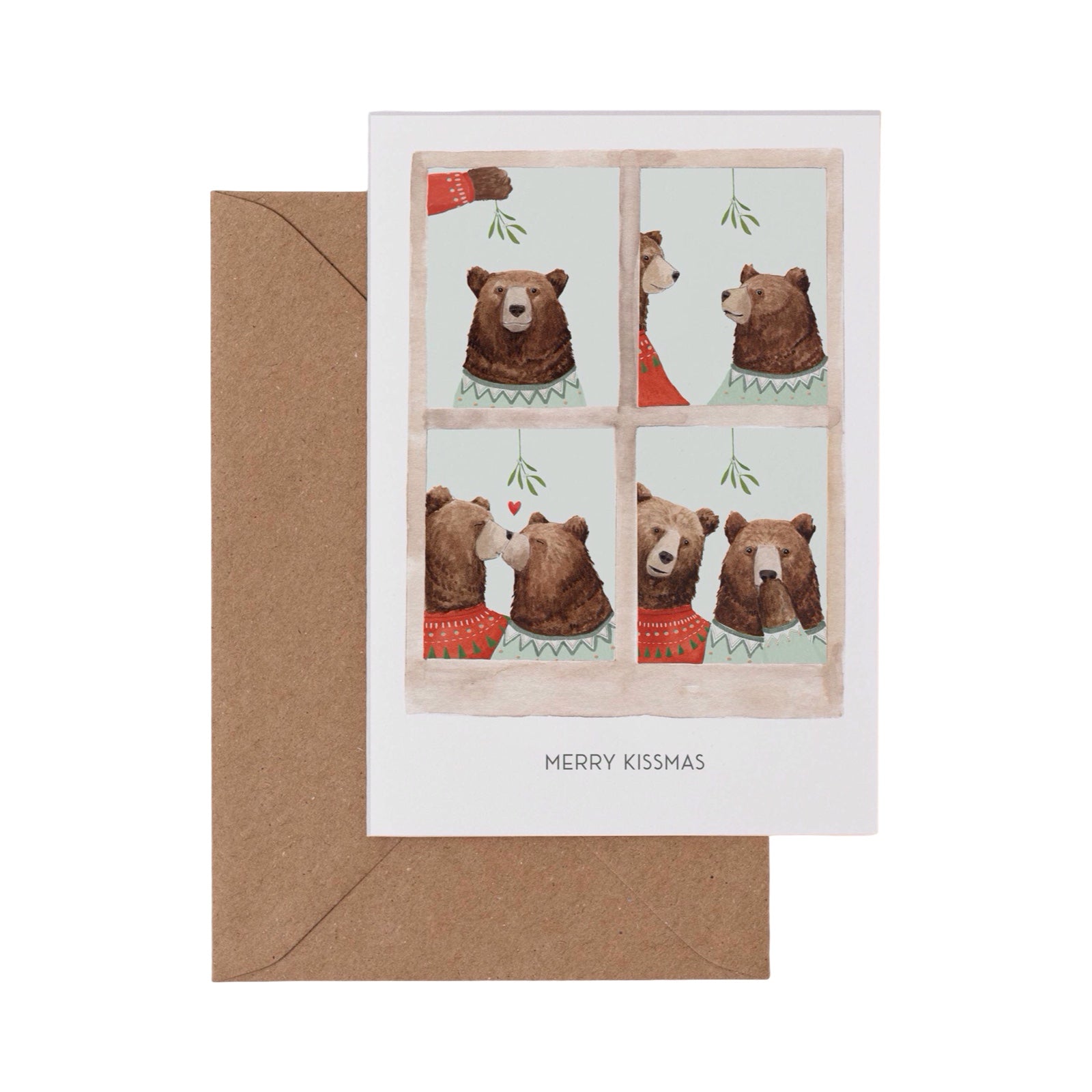 Greeting card with bears through a window design and 'Merry Kissmas' text, accompanied by a brown envelope.