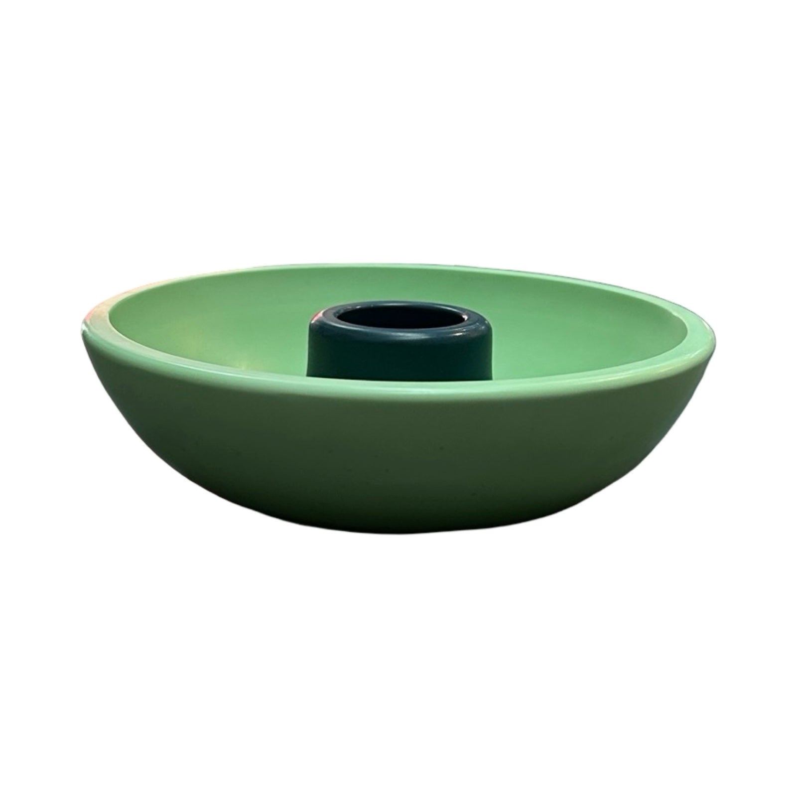 Green ceramic candle holder with a navy centre on a white background.