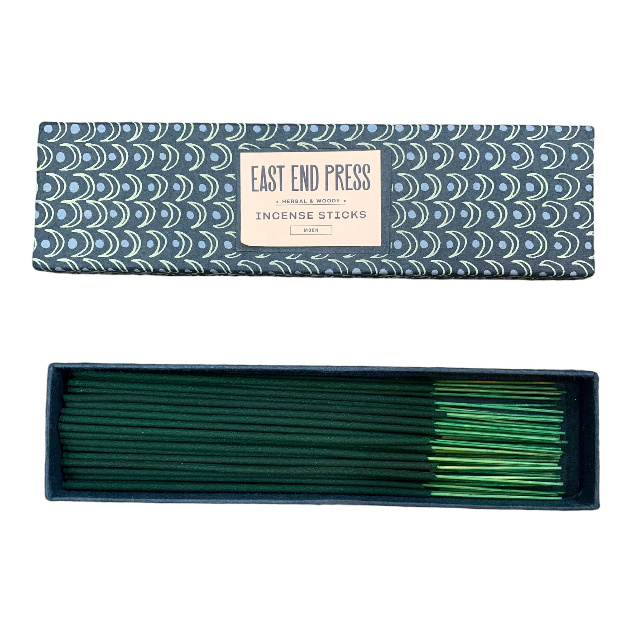 Herbal and woody incense sticks in a blue box with green moons.