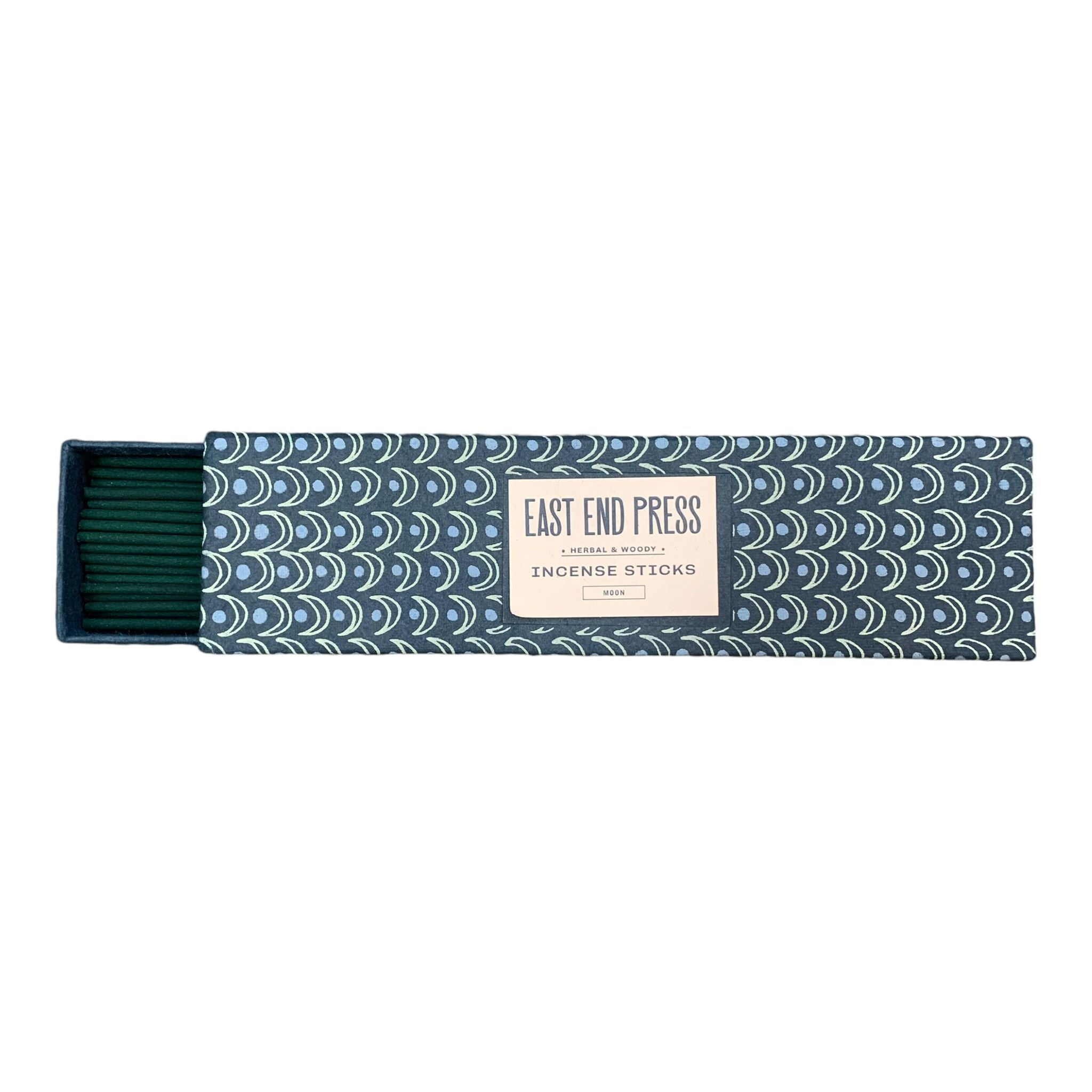 Herbal and woody incense sticks in a blue box with green moons.