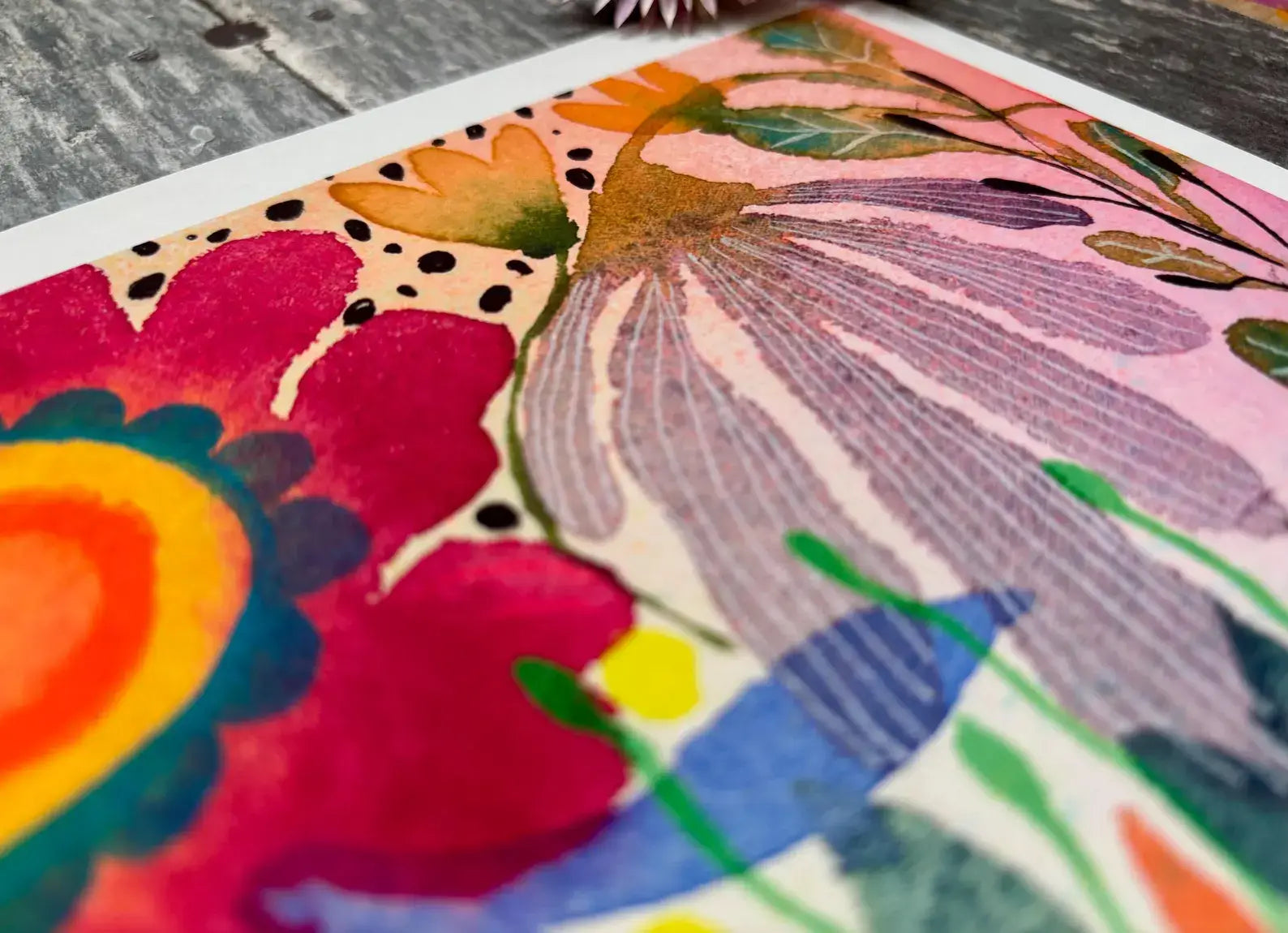 Colourful floral illustration on a textured surface.