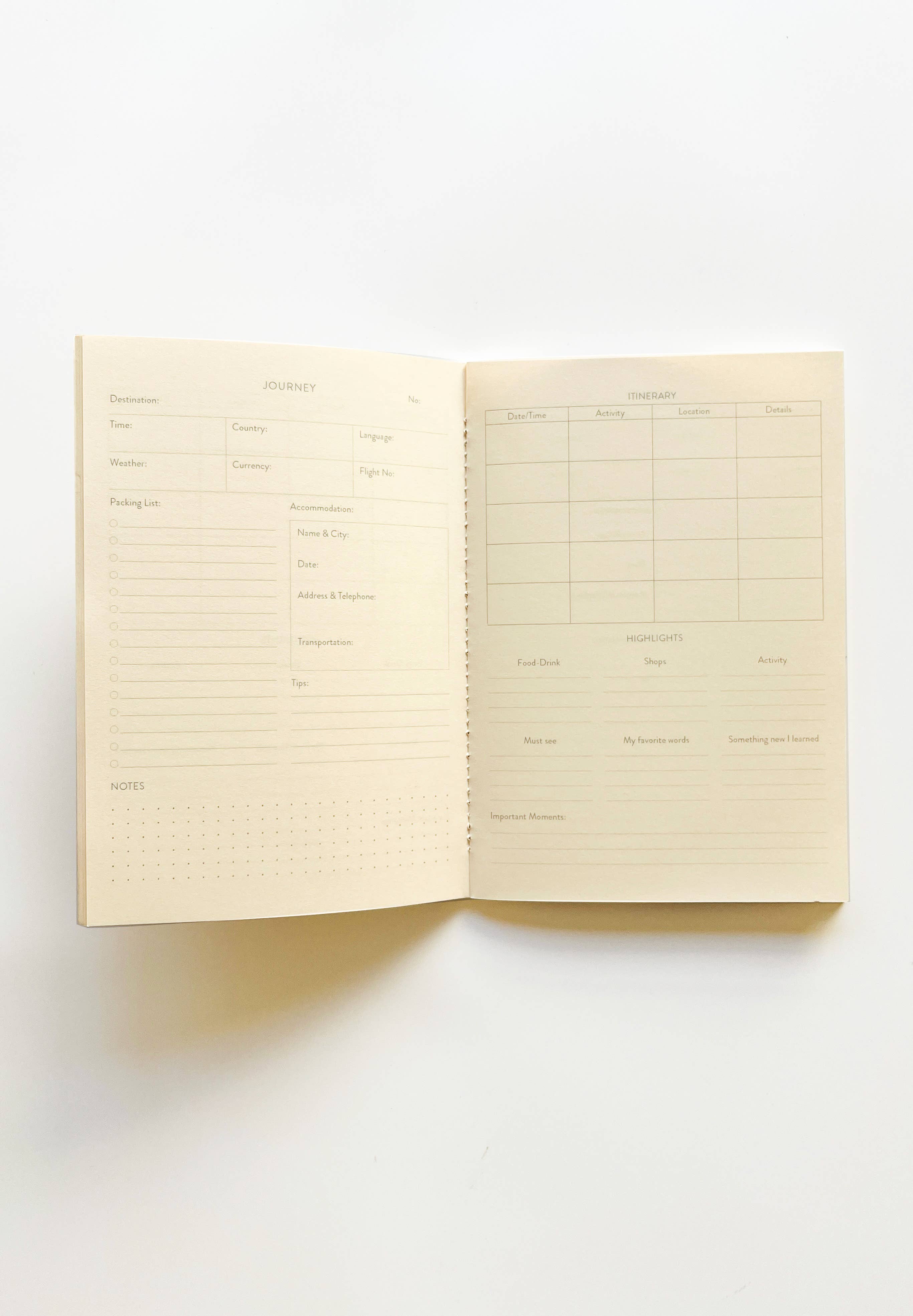 Open notebook with lined pages on a white background.