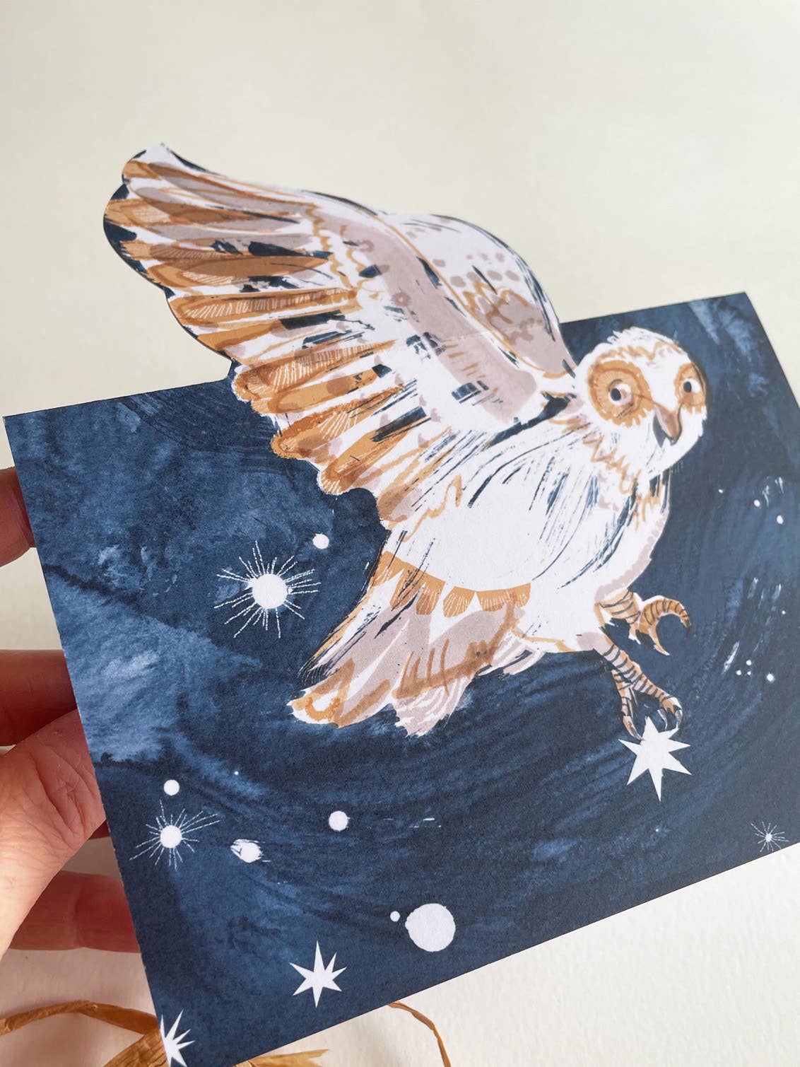 Card with a painted owl on a starry night background.