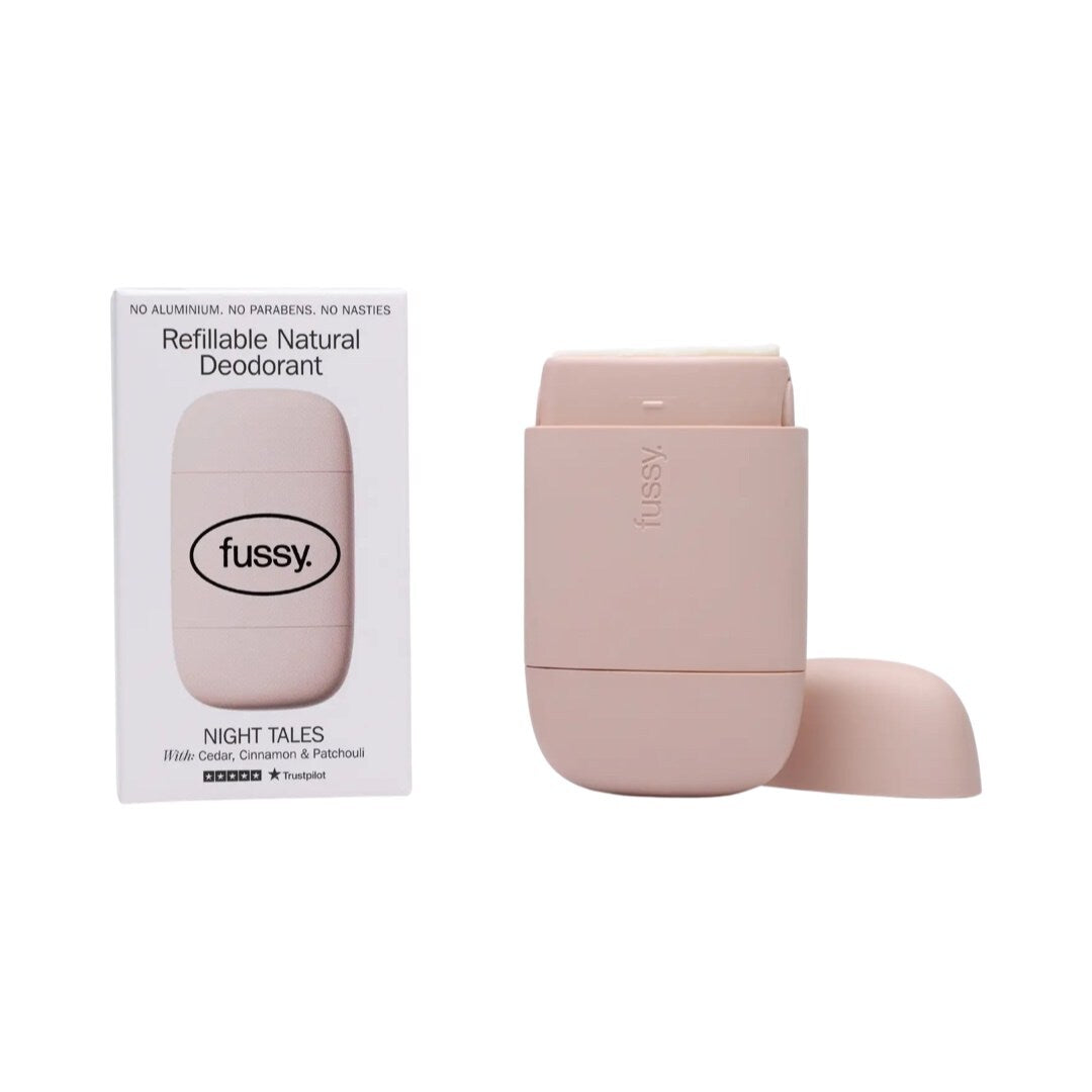 A pink refillable deodorant case and a packet of Fussy Night Tails refillable deodorant.
