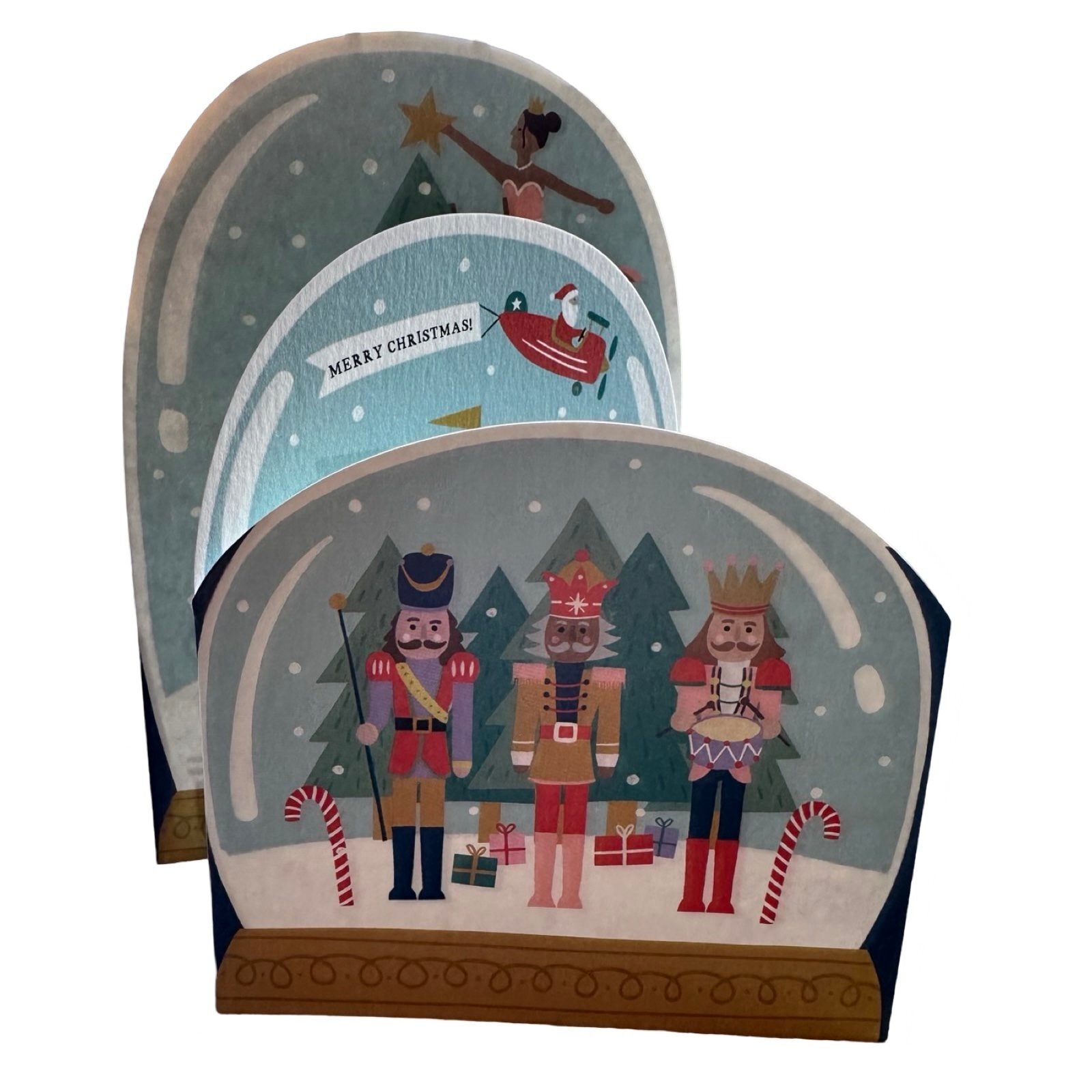 Concertina card of three snow globes, including: nutcrackers, a reindeer carousel with Father Christmas in an aeroplane, and the Mouse King, Prince, and Sugarplum Fairy decorating a Christmas Tree. Text reads 'Merry Christmas'.