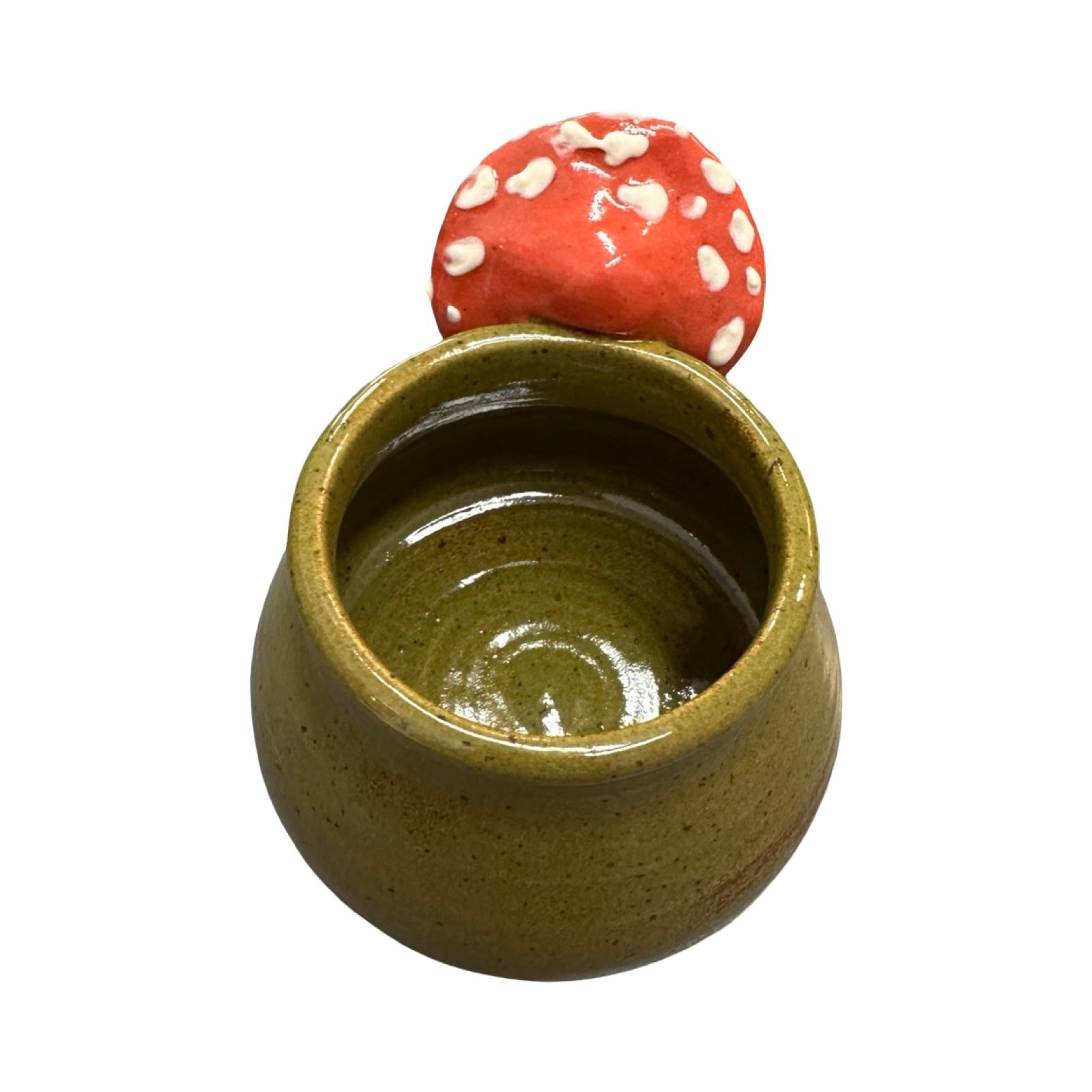 Ceramic container with a red mushroom-shaped handle on a white background.
