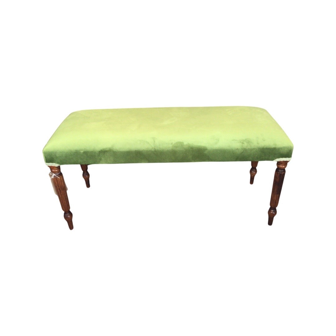 A rectangular velvet bench with mahogany stained legs in a olive green colour design.