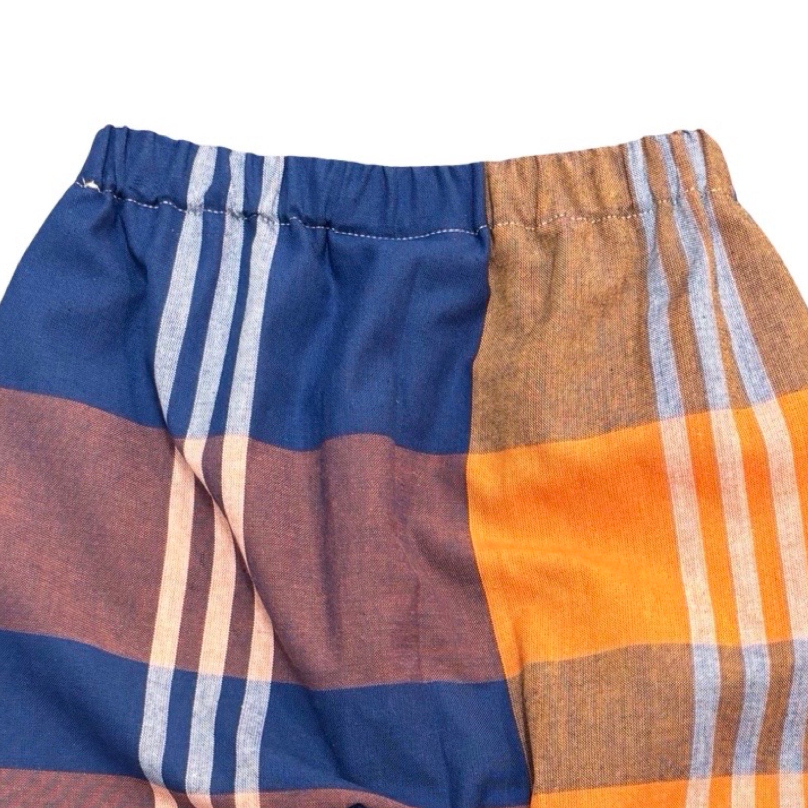Plaid shorts with blue, orange, and brown colours on a white background.