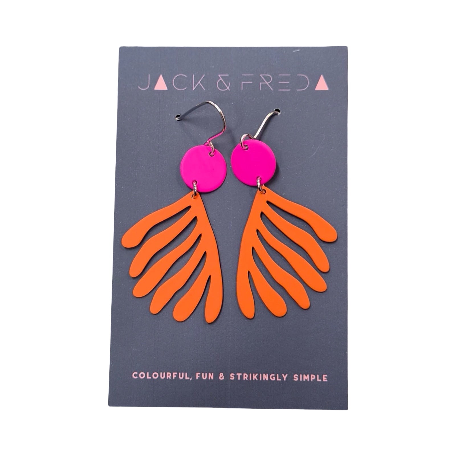 Orange earrings with pink circular tops on a Jack & Fred branded card.
